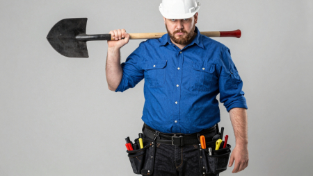 contractor with tool belt holding a shovel generated by Z-Image